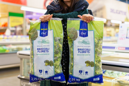 Frozen broccoli florets in a package. February 2, 2023 Beltsy, Moldova. For illustrative editorial...