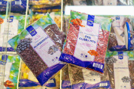 Frozen blueberries and red currants in a package. February 2, 2023 Beltsy, Moldova. For illustrative editorial use.のeditorial素材