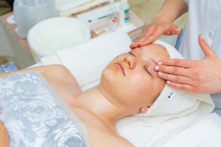 May 17, 2022 Balti Moldova. Beautician performs the procedure. Illustrative editorial. Backgroundのeditorial素材