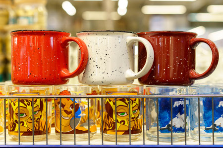 April 6, 2023 Beltsy, Moldova. For illustrative editorial use. Metal enameled cup or mug in a wholesale and retail store.のeditorial素材