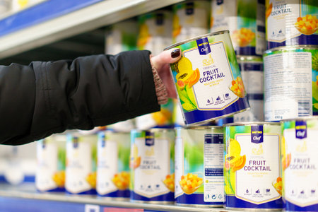 April 6, 2023 Beltsy, Moldova. For illustrative editorial use. Canned tropical fruits in syrup.のeditorial素材