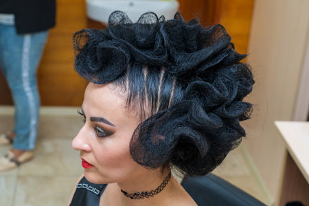 May 17, 2022 Balti Moldova. Hairdresser stylist makes hair styling. Illustrative editorial. Backgroundのeditorial素材