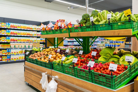 A department with fresh fruits and vegetables in a grocery supermarket. April 13, 2023 Beltsy, Moldova. For illustrative editorial use.のeditorial素材
