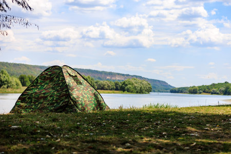 Tent for hiking or camping. Background with selective focus and copy spaceの写真素材