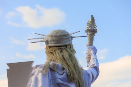 Living Statue of Liberty. USA holiday concept. Background with selective focus and copy space for textの写真素材