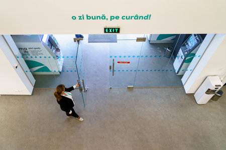 January 18, 2022 Beltsy, Moldova. For illustrative editorial use. Bank administrator greets clients