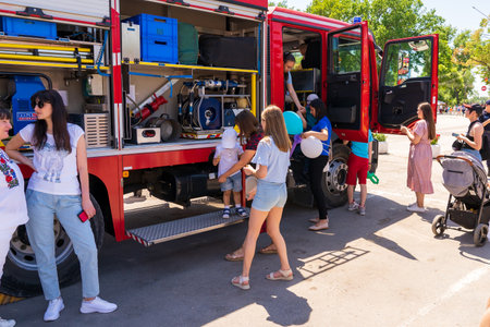 June 1, 2023 Beltsy, Moldova. For illustrative editorial use. Children are entertained by rescuers...