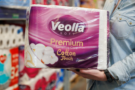 October 11, 2023 Beltsy, Moldova. For illustrative editorial use. Toilet paper in the hands of a buyerのeditorial素材