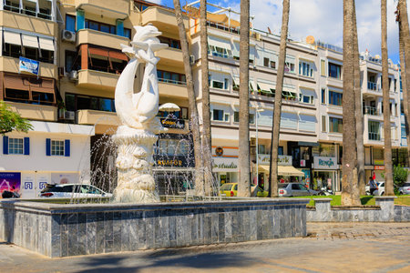 August 6, 2023 Marmaris Turkey. For illustrative editorial use. Fountain with a sculpture of dolphins in the city centerのeditorial素材