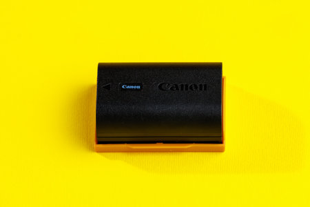 August 30, 2023 Chisinau Moldova. Battery lp-e6NH for Canon camera. Background with copy space for...