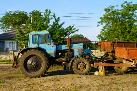 May 23, 2023 Dobruja village, Singerei district, Moldova. For illustrative editorial use. Farmer's tractorのeditorial素材