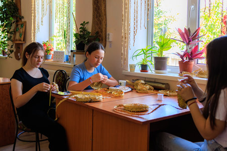 June 21, 2023 Rautel Moldova. For illustrative editorial use. Children doing folk craftsのeditorial素材