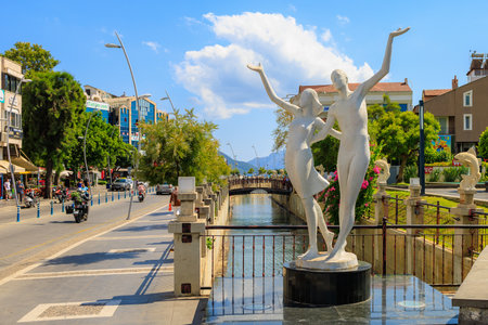 August 6, 2023 Marmaris Turkey. For illustrative editorial use. Sculpture of a happy couple in a resort townのeditorial素材