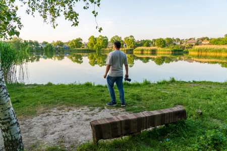 May 23, 2023 Dobruja village, Singerei district, Moldova. For illustrative editorial use. Man enjoying a beautiful sunrise or sunsetのeditorial素材