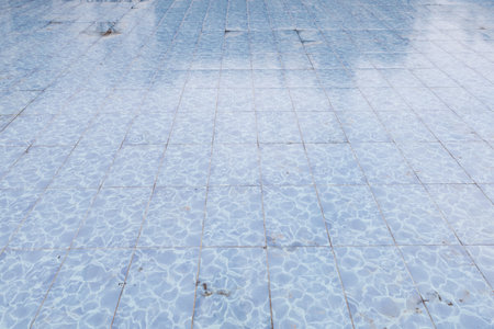 Tiled pool floor. Background with selective focus and copy spaceの写真素材