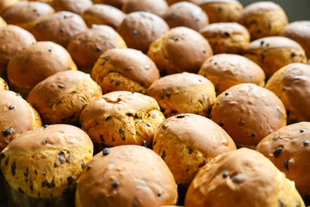 A bunch of brown bread with chocolate chips on top. There are many of them. They are all the same...