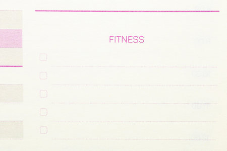 A white piece of paper with pink writing that says Fitness on it. There are also check boxes on the...