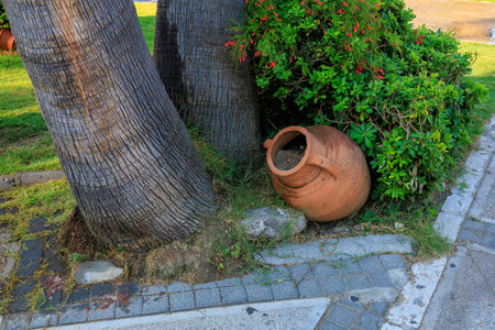Clay jug in the scenery of the city. Background with selective focus and copy space for text.の写真素材