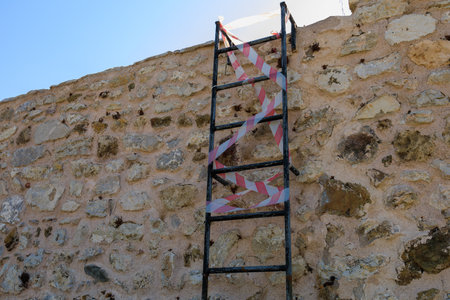 Staircase with prohibited entrance to the roof of the fortress. Background with selective focus and copy space for text.の写真素材