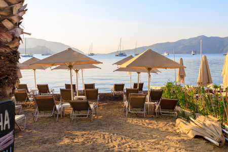 Sun loungers on the beach. Background with selective focus and copy space for text.の写真素材