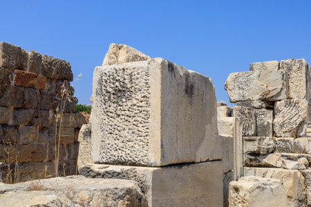 Preparing a stone block from ancient architecture. Background with selective focus and copy space for textの写真素材