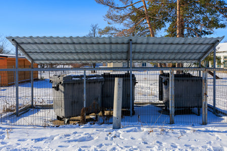 Garbage containers in winter. Background with selective focus and copy space for textの写真素材