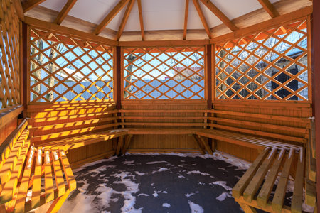 Gazebo in winter in the snow. Background with selective focus and copy space for textの写真素材