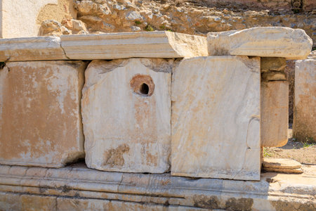 Antique wall made of huge blocks with minimal gaps. Background with selective focus and copy space for textの写真素材