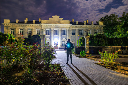 A traveler explores the city at night. Background with selective focus and copy space for textの写真素材