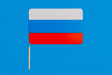 Flagpole in the form of a match with the flag of Russia. Background with selective focus and copy space for textの写真素材
