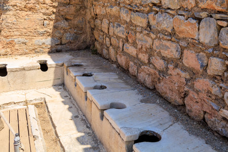 Antique Roman public toilet in the city of Ephesus. Background with selective focus and copy space...