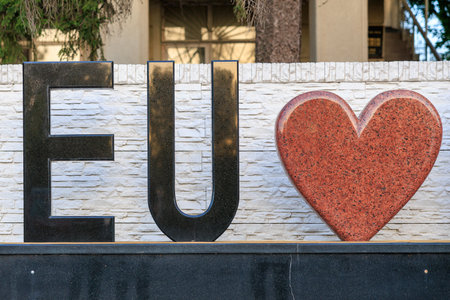 Text EU and heart, concept of love for the European Union. Background with selective focus and copy space for textの写真素材