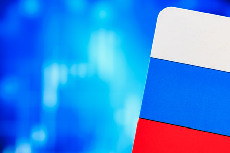 Russian flag against abstract blue background with digital elements.の写真素材