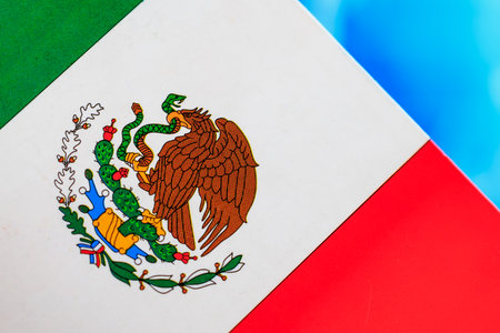 Mexican flag with national emblem and vibrant colors.の写真素材