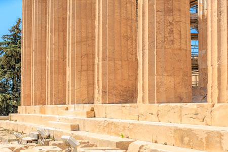 The building is made of stone and has a lot of columns. The columns are very tall and the building...