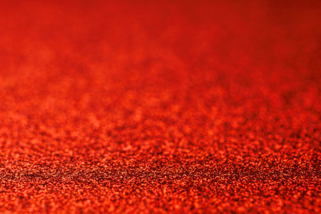 A red background with a red and white pattern. The red background is the main focus of the imageの写真素材