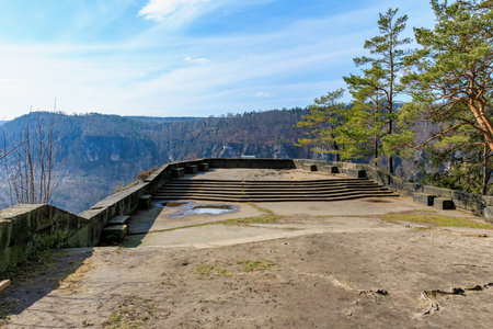 Scenic mountain viewpoint with stone terrace and steps in a natural landscape.の写真素材