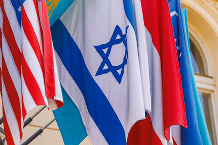 International flags displayed outdoors with prominent israeli and american flags.の写真素材