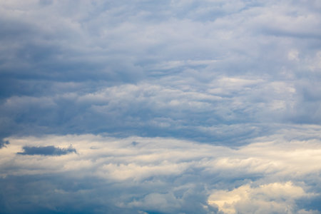Cloudy sky with layers of overcast atmosphere in natural light.の写真素材