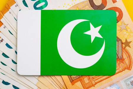 Pakistan flag on currency notes: economic interaction with euros and dollars.
