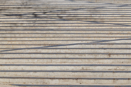 Geometric concrete steps with linear patterns in outdoor urban area.の写真素材