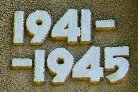 The numbers 1941-1945 are written in white on a brown surface. The numbers are in a cursive style, and the letters are slightly larger than the numbers. Concept of nostalgia and historyの写真素材