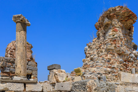Ruins of ancient columns. Background with selective focus and copy space for textの写真素材