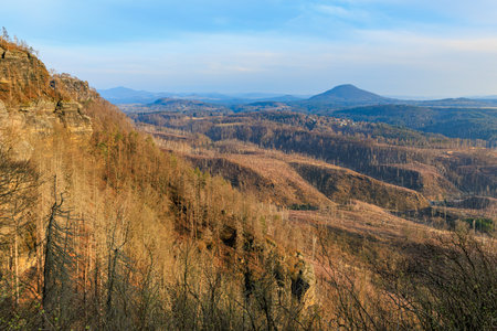 Scenic view of saxon switzerland national park with rolling hills and rock formations.の写真素材