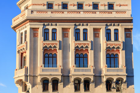 Historic european building facade with decorative windows and architectural details.の写真素材
