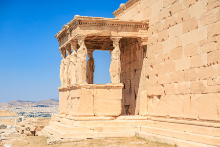 A stone building with a balcony and a statue of a woman on it. The building is old and has a lot of...