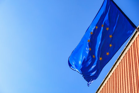 European union flag against clear blue sky on a sunny day.の写真素材