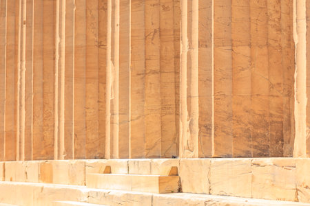 The wall is made of stone and has a lot of columns. The wall is very old and has a lot of history,...