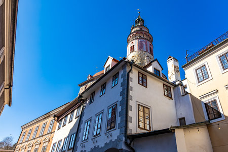 Historic castle tower against clear blue sky.の写真素材