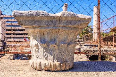Ancient roman ionic capital in outdoor archaeological site. Authentic ancient Smyrna ruins in Izmir, Turkey.の写真素材